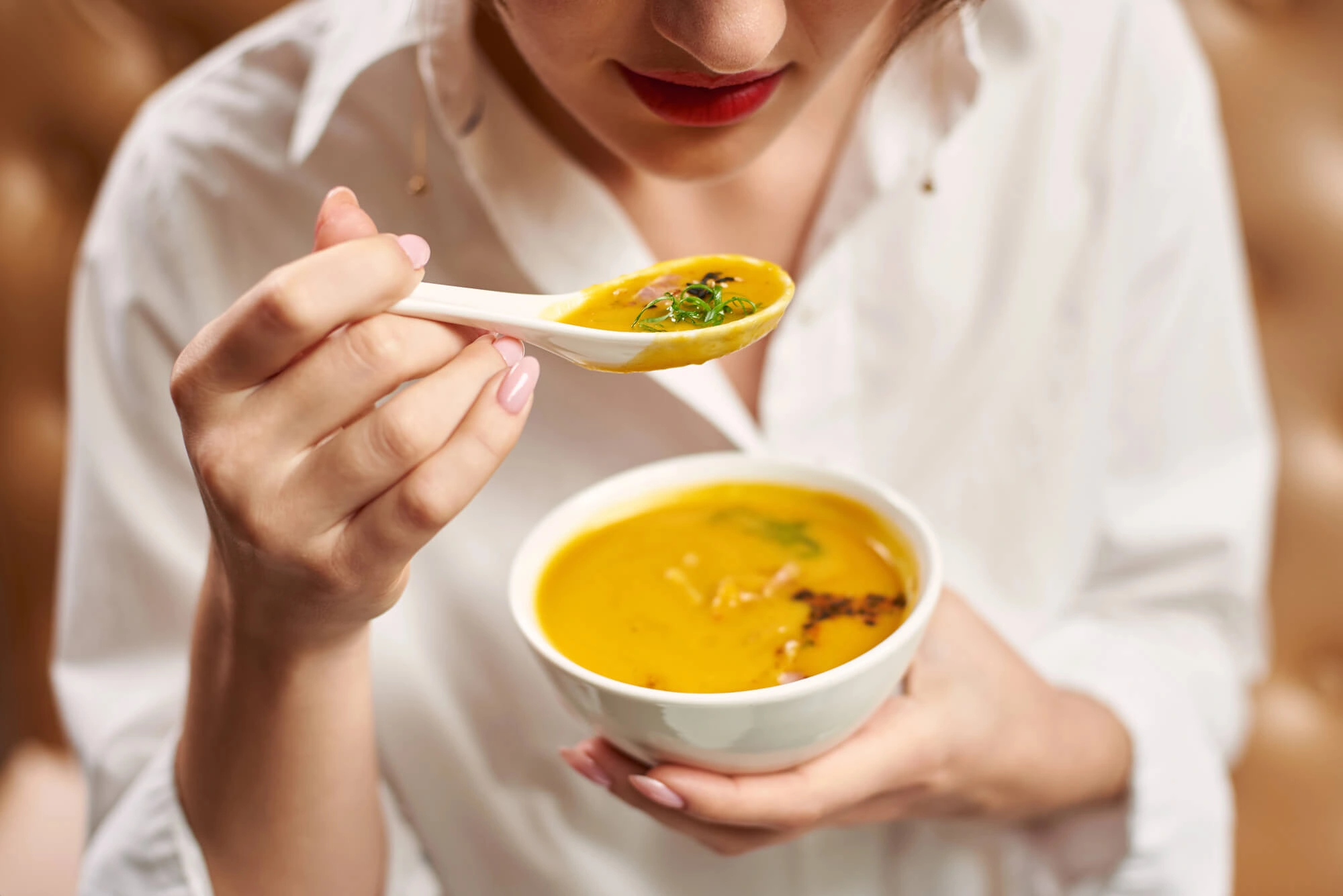 enjoying soup after getting All-on-X Dental Implants