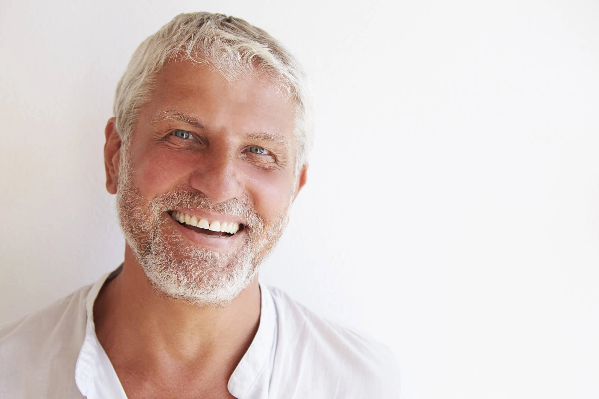 man showing off his Same-Day Dental Crowns