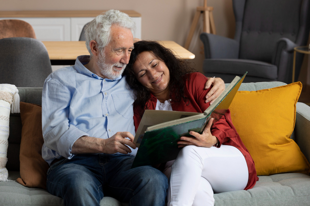 Family member talking with a Spring Oak memory care team member in a warm community common area