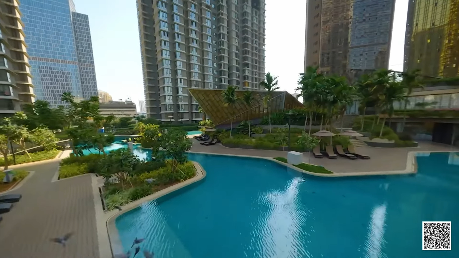 Landscaped pool deck between residential towers in Mumbai
