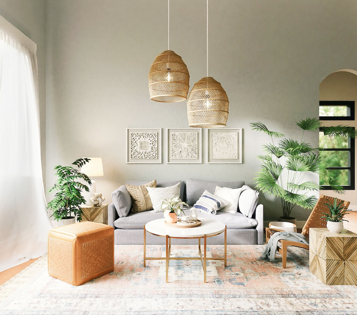 A bright living room with rattan pendant lights, a grey sofa and indoor plants