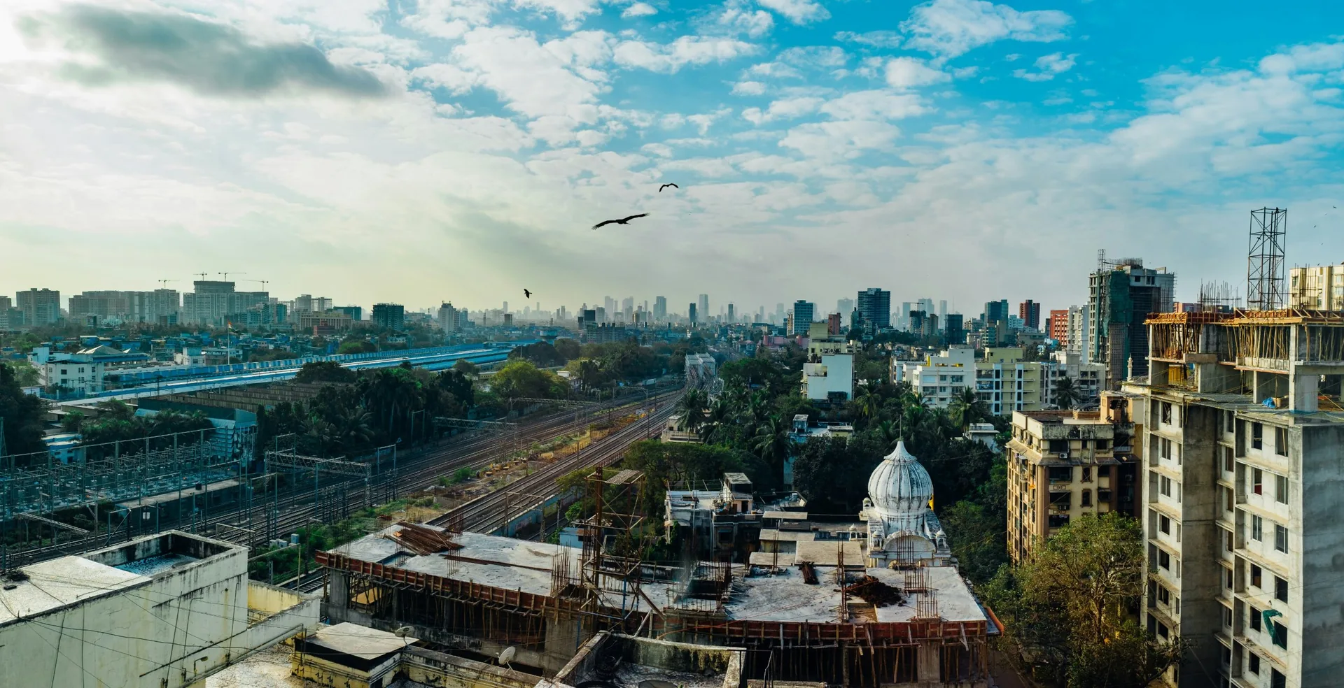 Mumbai skyline with older buildings and new redevelopment towers