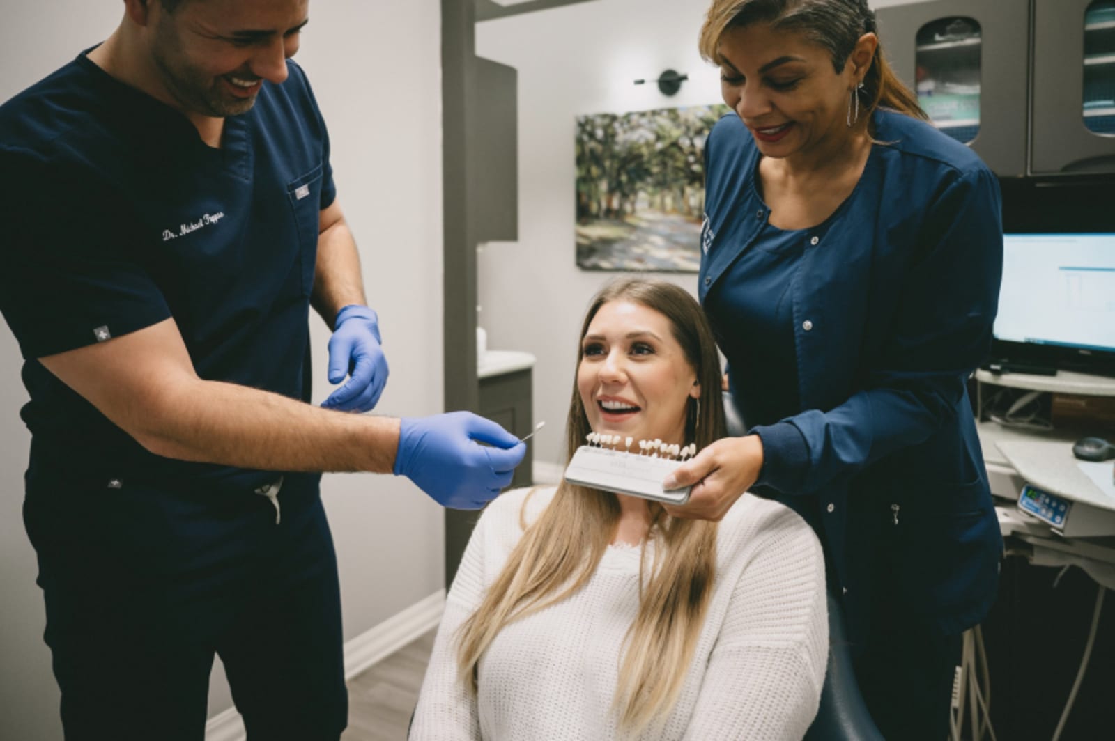 Dental team consulting with patient about treatment options and planning