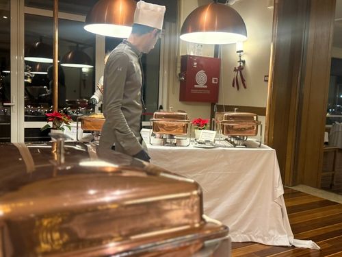 Chef oversees catering buffet at a reception