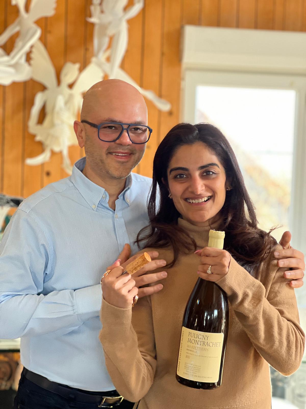 Sujan Parikh’s wife opening a bottle of Puligny-Montrachet by Pierre-Yves Colin-Morey with her bespoke rose gold bronze Forest Audiard Corkscrew.