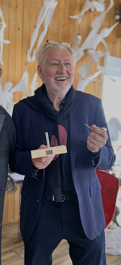 Pierre Gagnaire smiling as he receives his bespoke silvered bronze Forest Audiard Corkscrew.