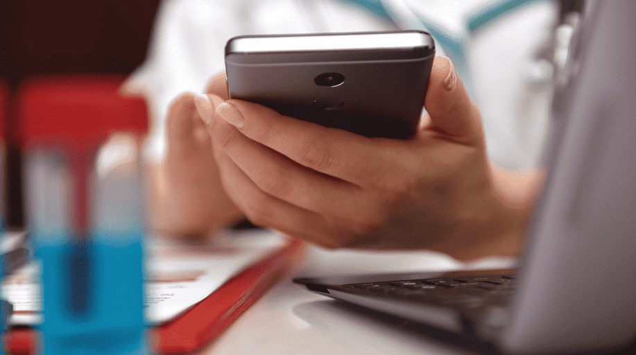 Close-up of person holding smartphone.