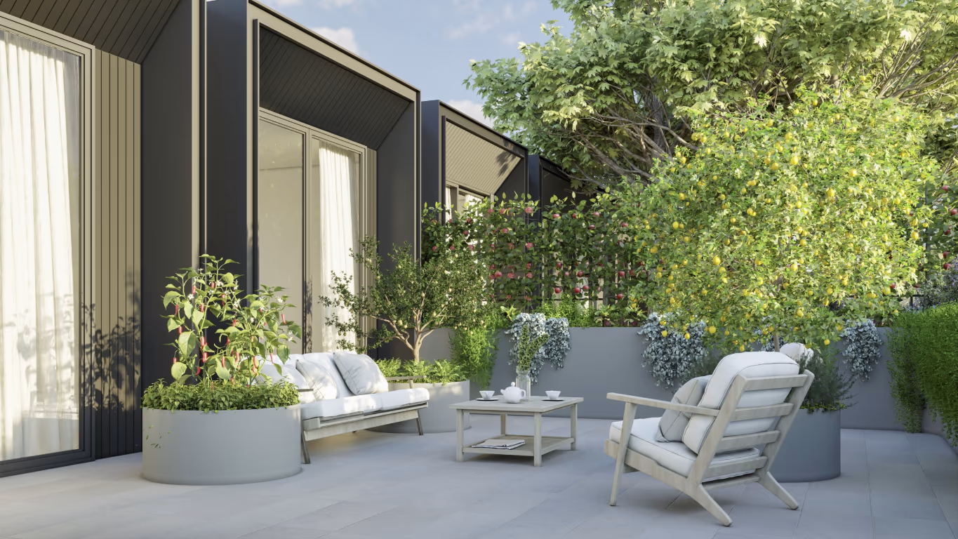 Modern patio with white furniture, planters, and lemon trees near building