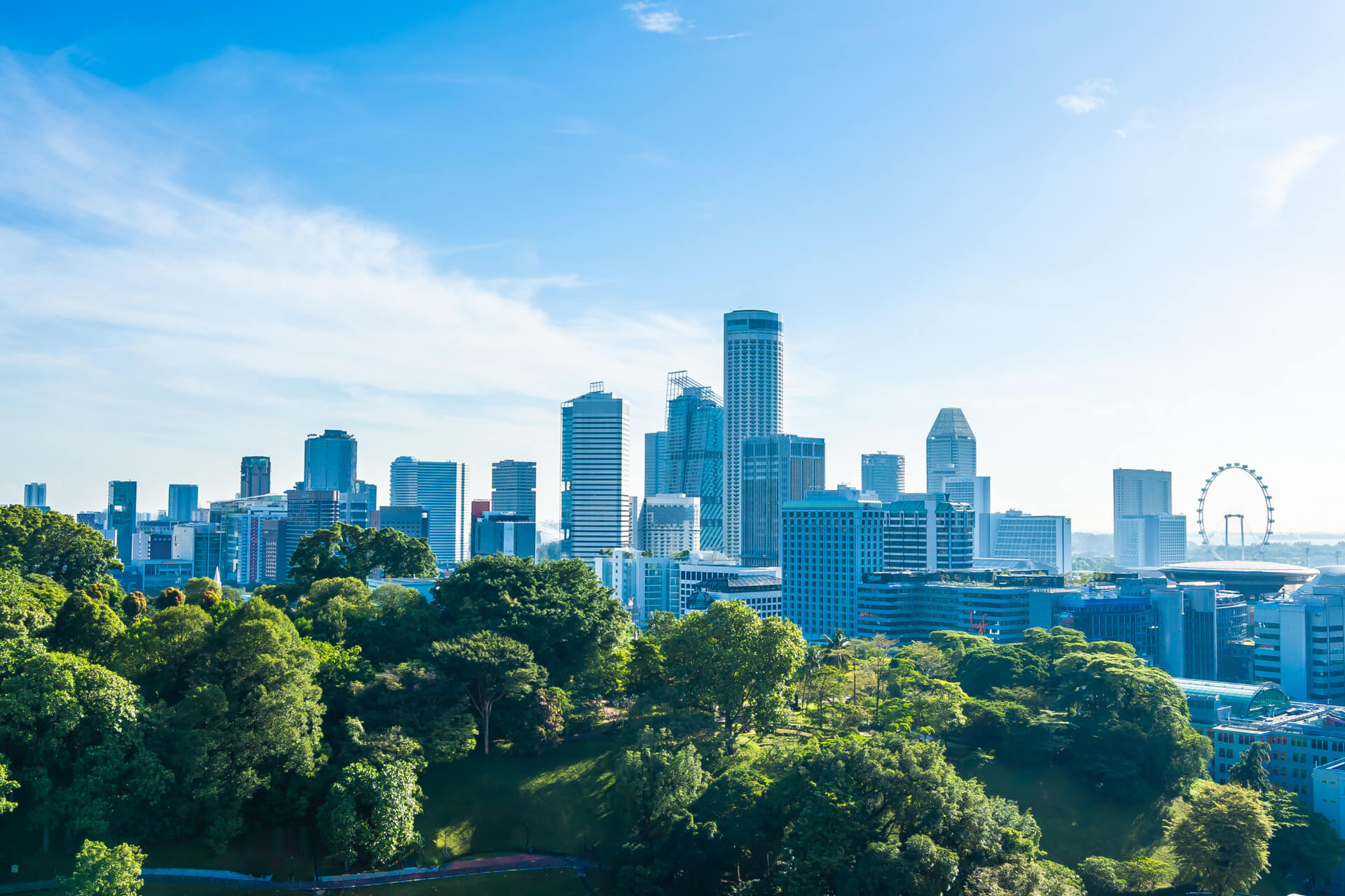 Singapore skyline with lush green trees and modern skyscrapers