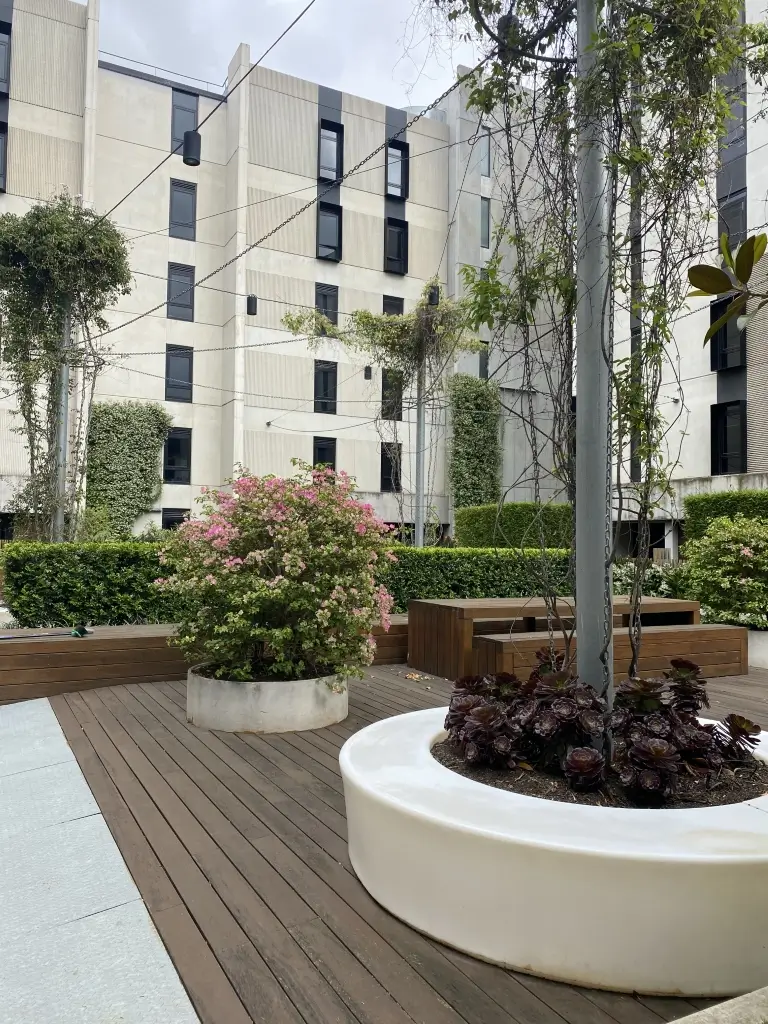 Apartment building with plants on top of walls