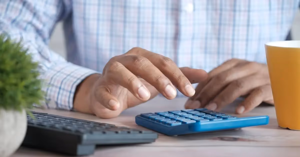 Close-up of an accountant's hands using a calculator