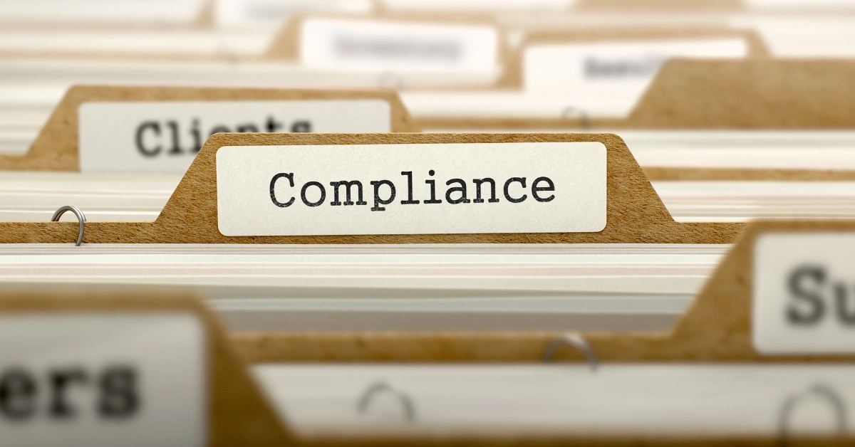 File folder with the word "Compliance"