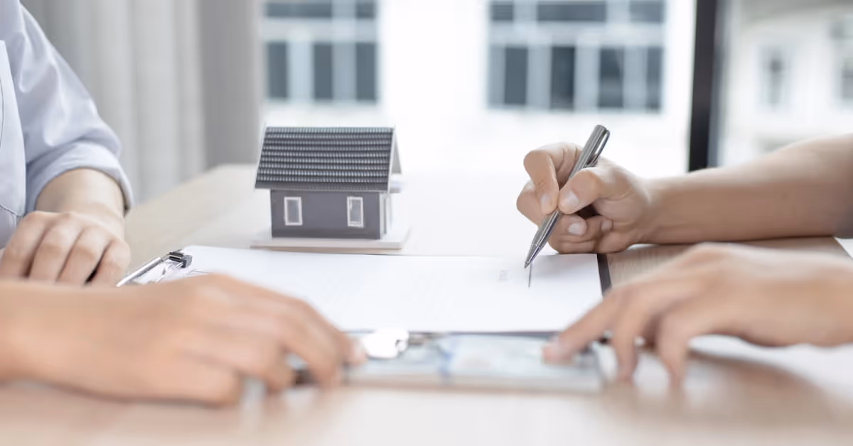 A person signing a lease contract