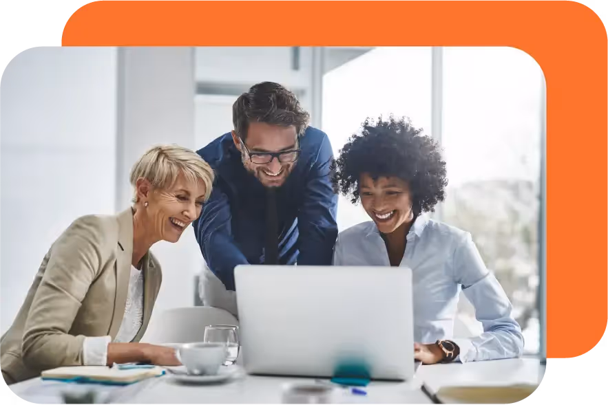 3 business people looking at a laptop together