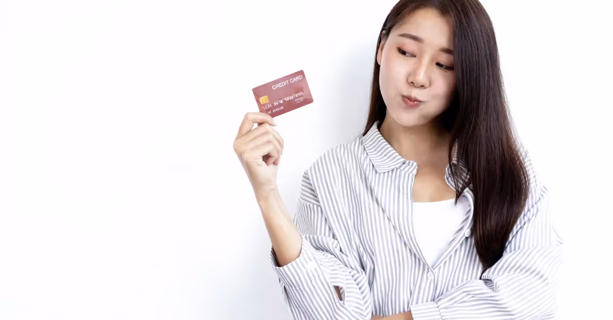 girl holding a credit card 