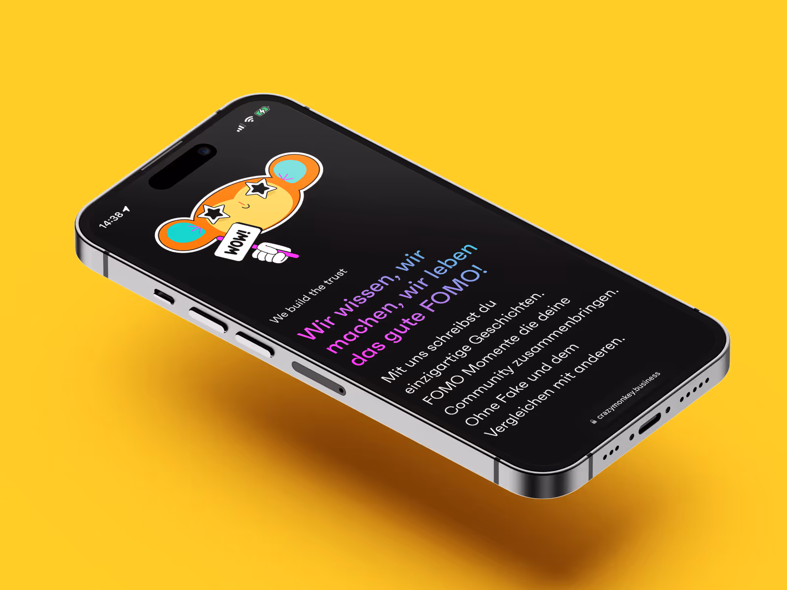 Mobile hovering above surface showing a screen of the crazy monkey website.