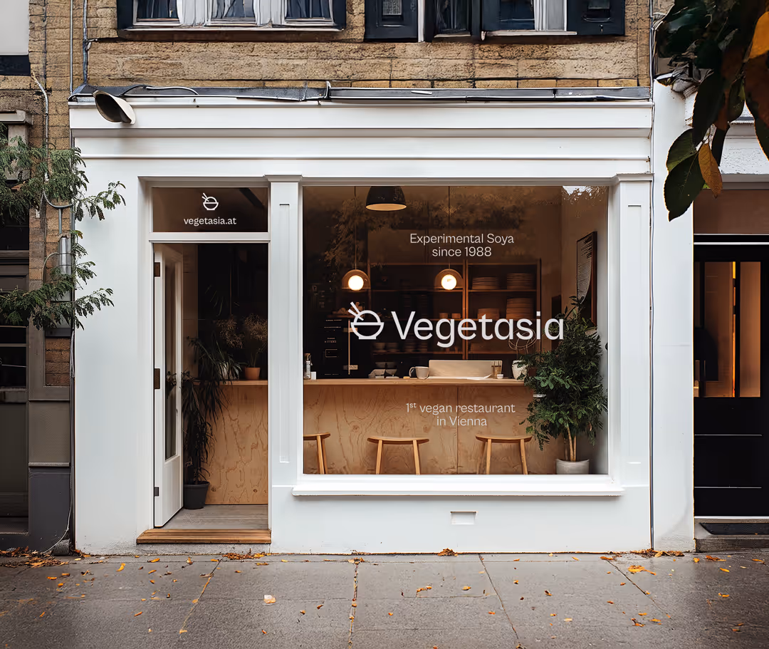 Storefront showing restaurant branding on the windows