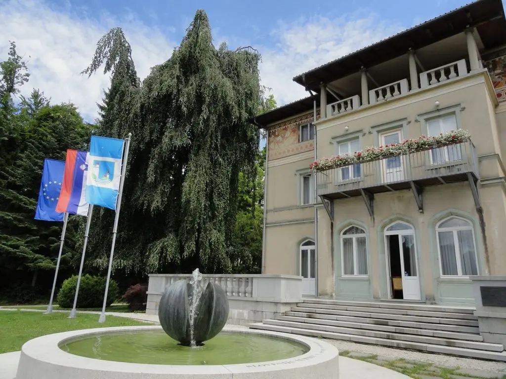 Bled Town Hall with fountain in front, a charming venue for a Lake Bled wedding ceremony.