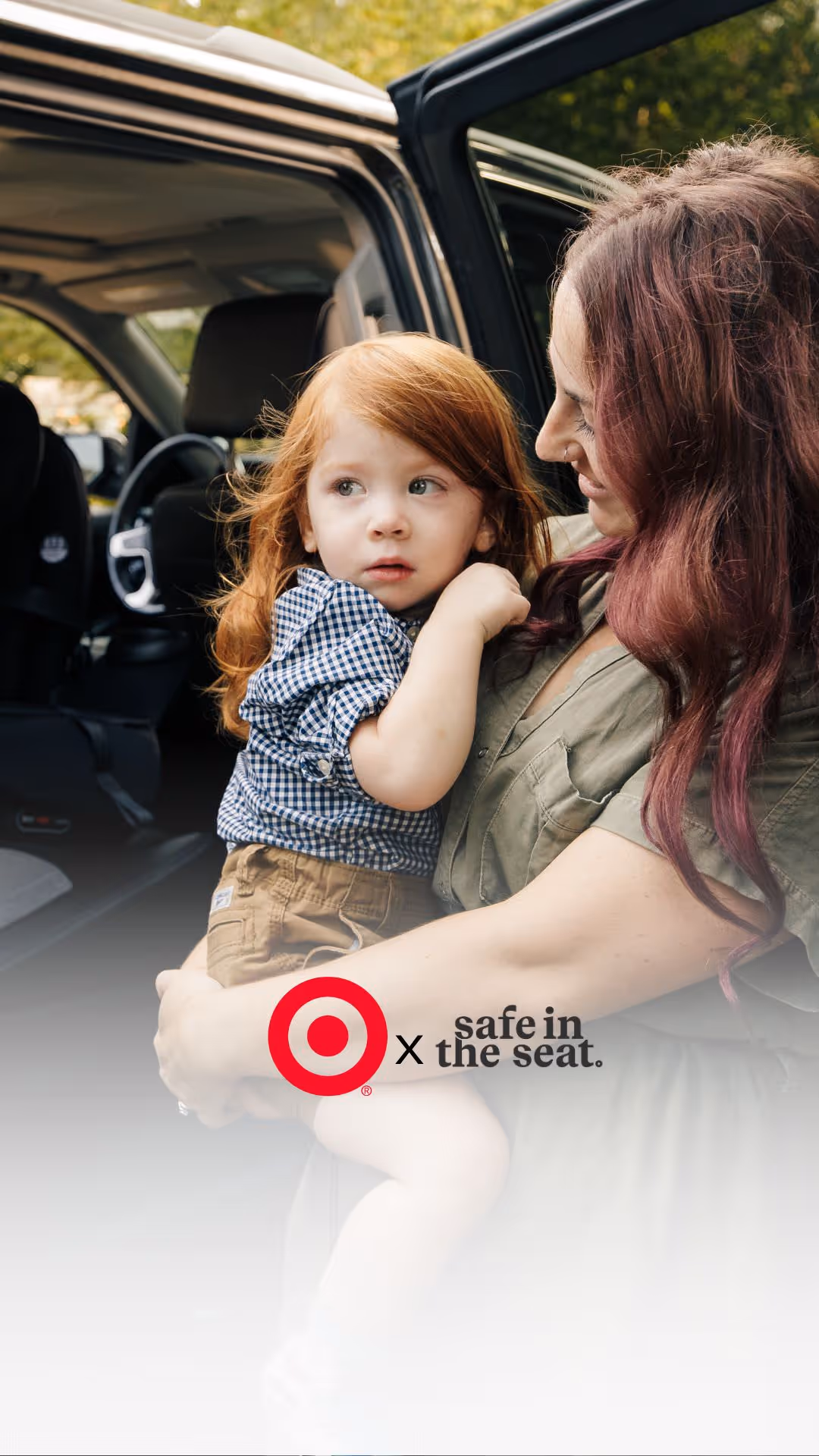 A woman holding a small child in her arms