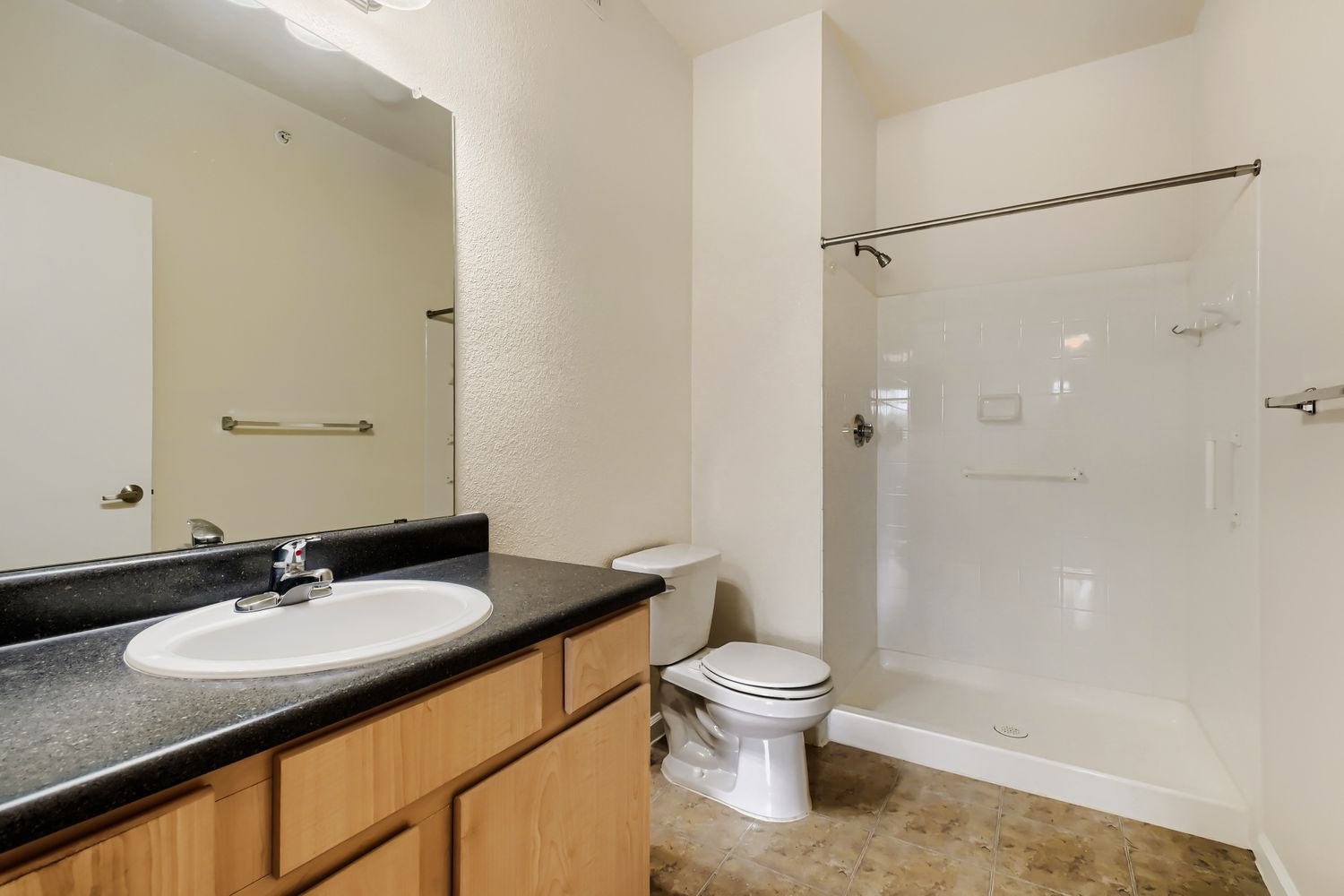 Bathroom with brown cabinets