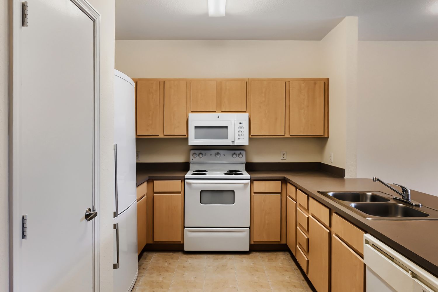 Kitchen with brown cabinets