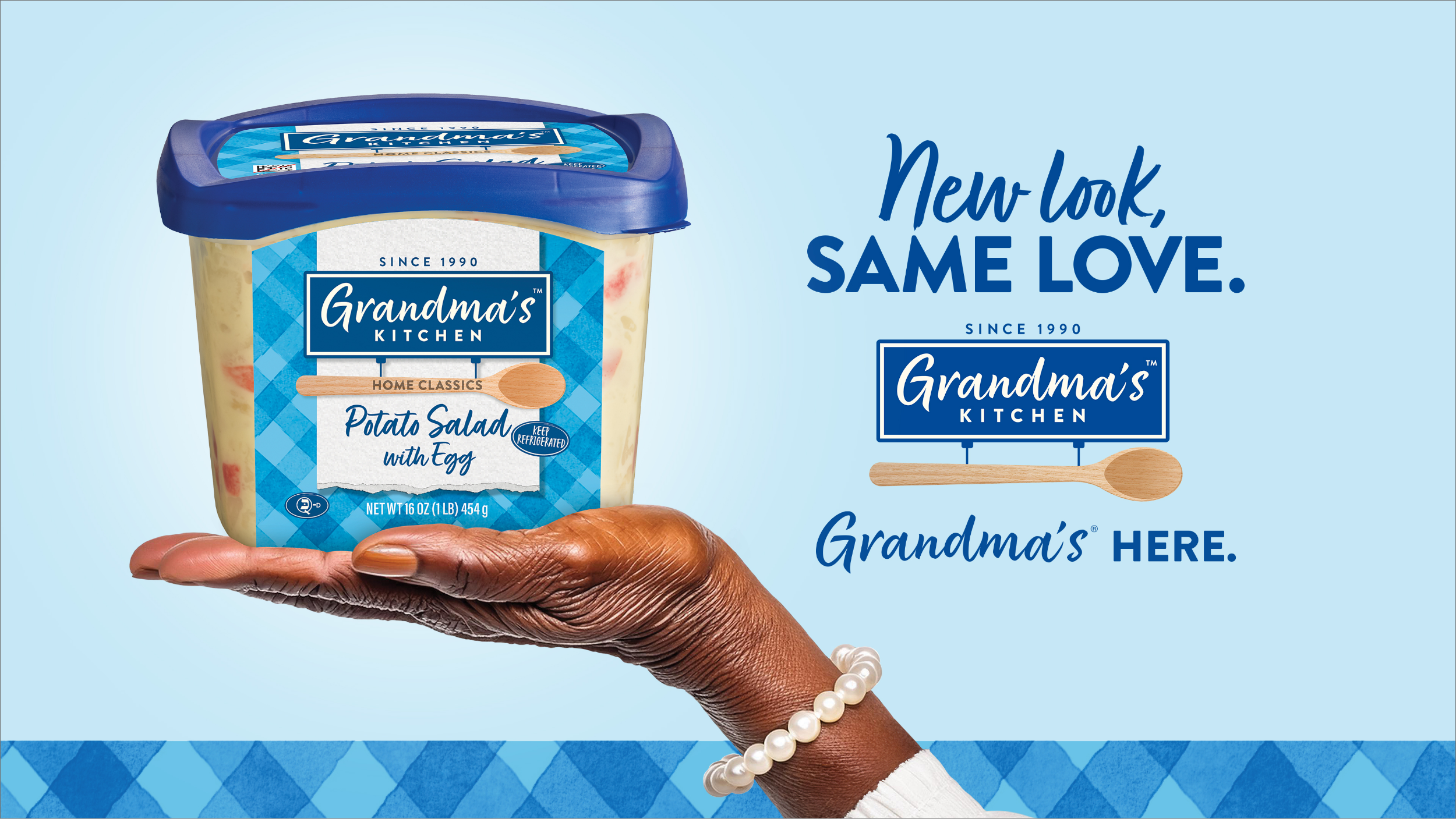 A blue checkered background with a white vertical strip, featuring a sign that reads Since 1990 Grandma’s Kitchen and a wooden spoon placed underneath the sign.