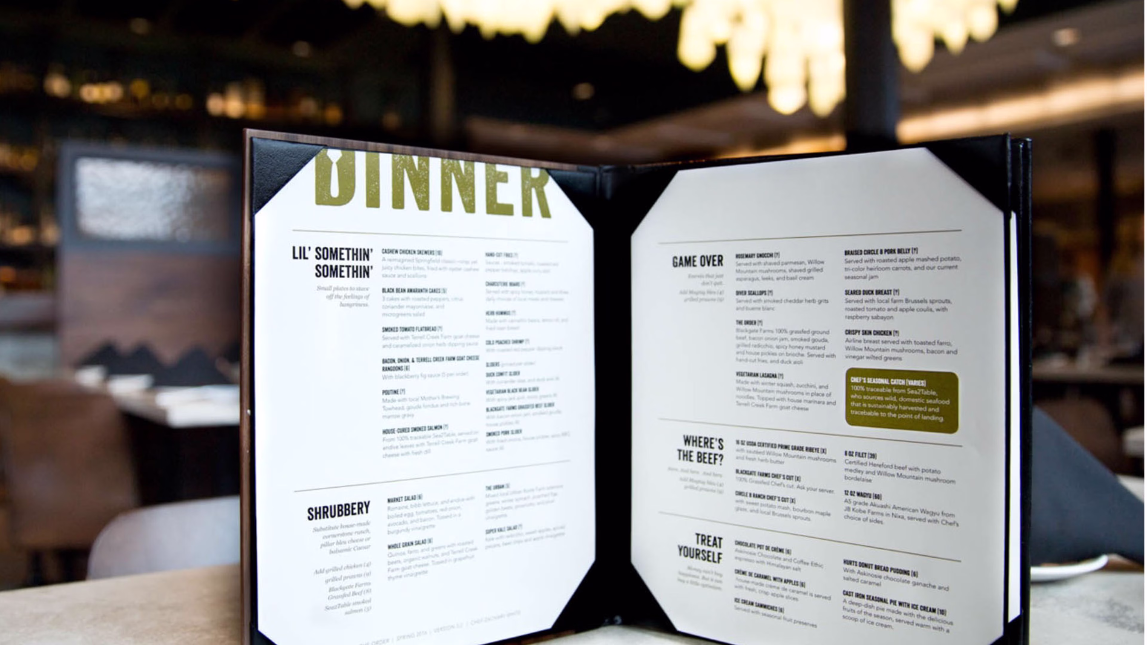 An open dinner menu for a restaurant, featuring sections titled Lil Somethin Somethin, Shrubbery, Game Over, Wheres the Beef?, and Treat Yourself.