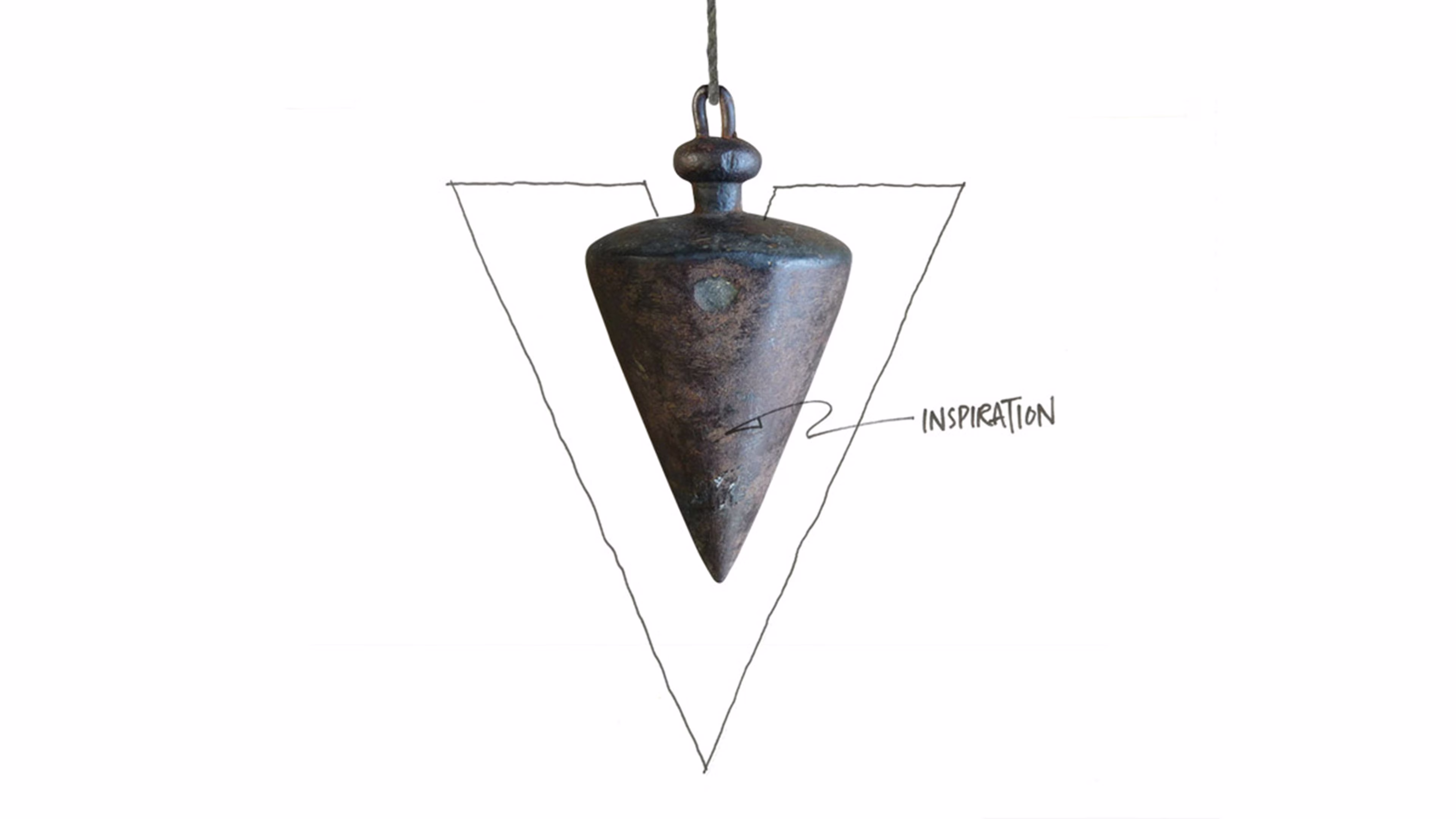 A metal plumb bob suspended over a hand-drawn triangle with an arrow pointing to the weight labeled INSPIRATION.