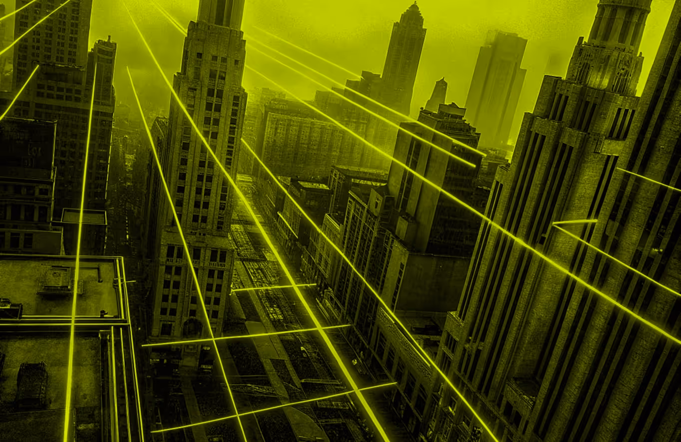 Aerial view of a cityscape with tall buildings intersected by glowing yellow laser-like lines.