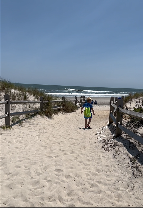A woman and a little girl on the beach