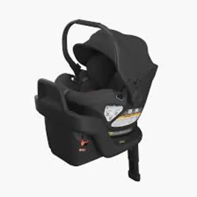 UPPAbaby Aria infant rear-facing car seat with adjustable canopy and padded newborn insert.