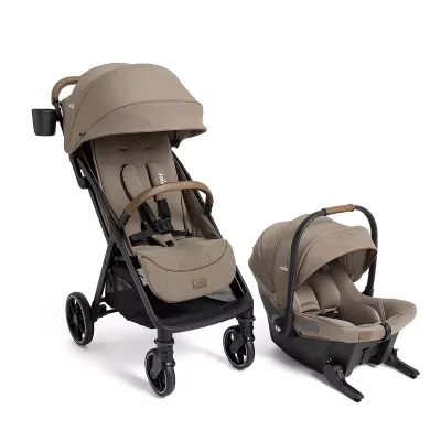 Joie Nutmeg with Mint infant car seat, rear-facing carrier with mint-accent canopy.