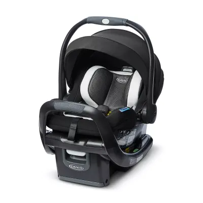 Graco SnugRide SnugFit 35 DLX infant car seat — rear-facing with base, canopy, five-point harness