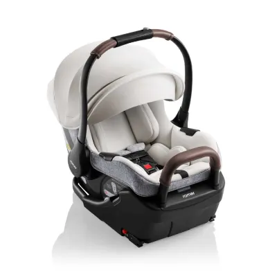 Juni by Romer infant rear-facing car seat with padded headrest and adjustable five-point harness.