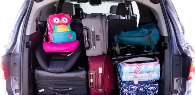 The back of a car with luggage packed in it