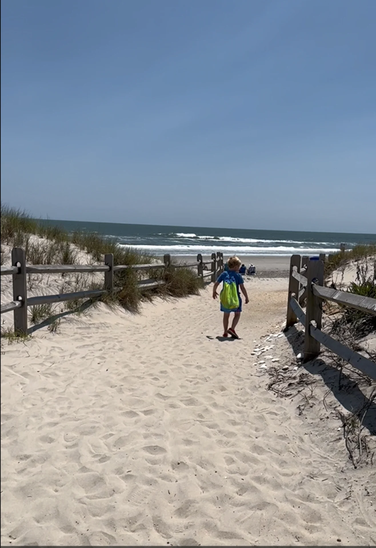 A woman and a little girl on the beach