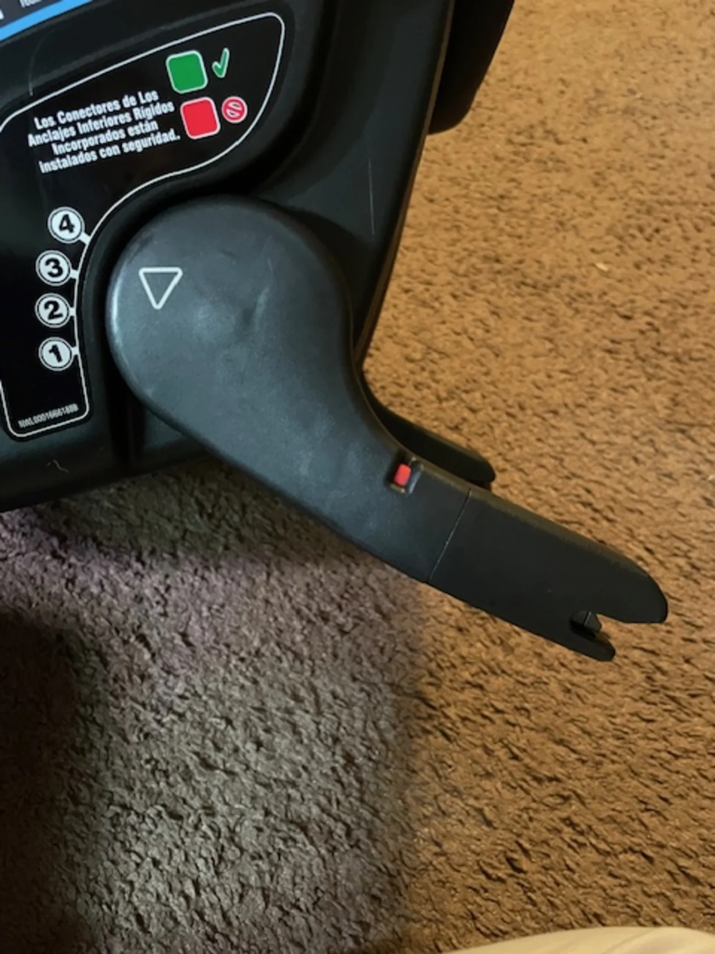 Close-up of Graco GoMax baseless infant car seat showing LATCH connector arm with red indicator light and green red installat