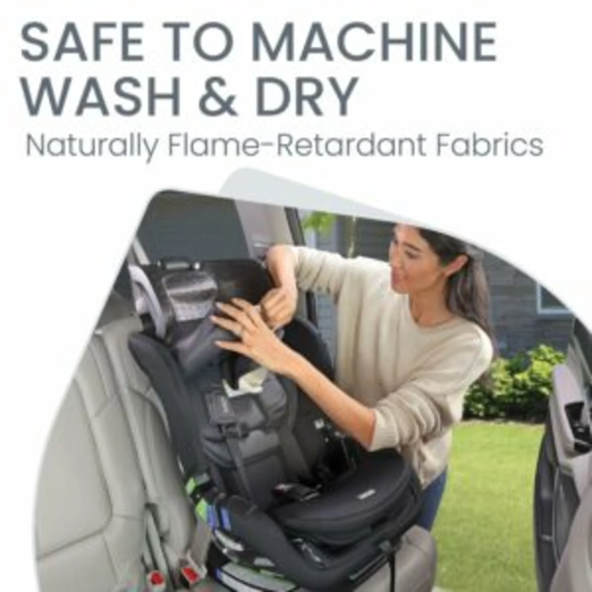 Woman removing fabric cover from Britax Poplar convertible car seat installed in vehicle highlighting machine wash and dry ca