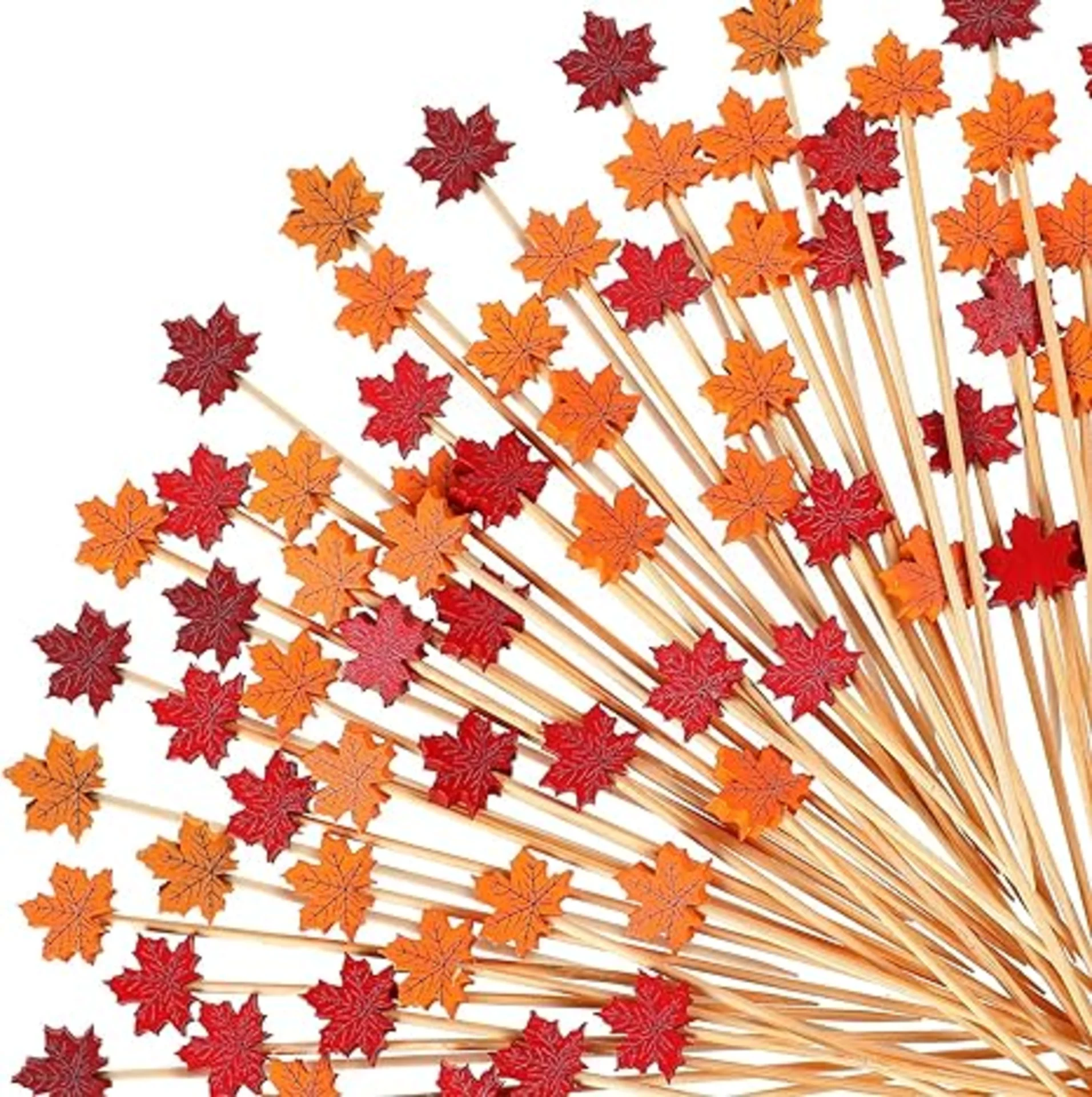 Fan-spread of bamboo toothpicks topped with red and orange maple leaf decorations for fall Halloween party entertaining