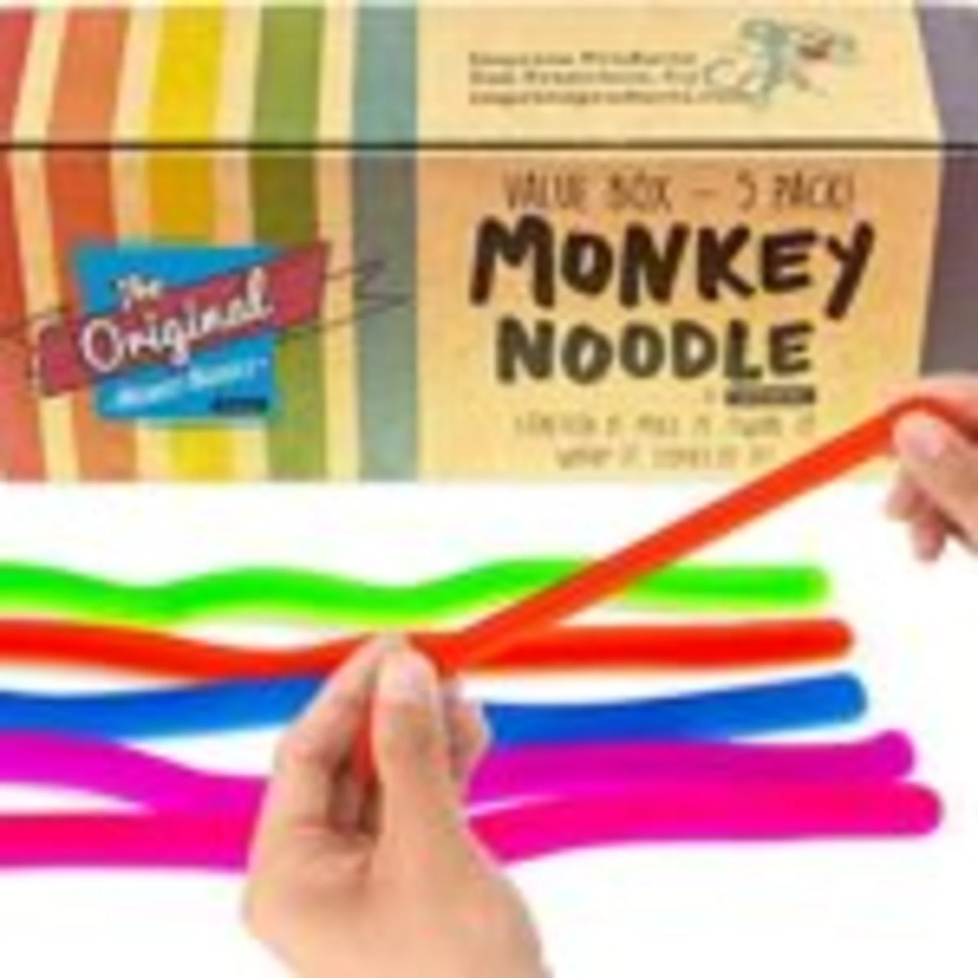 The Original Monkey Noodle 5-pack value box with colorful stretchy noodles in red, green, blue, and pink being held by two ha