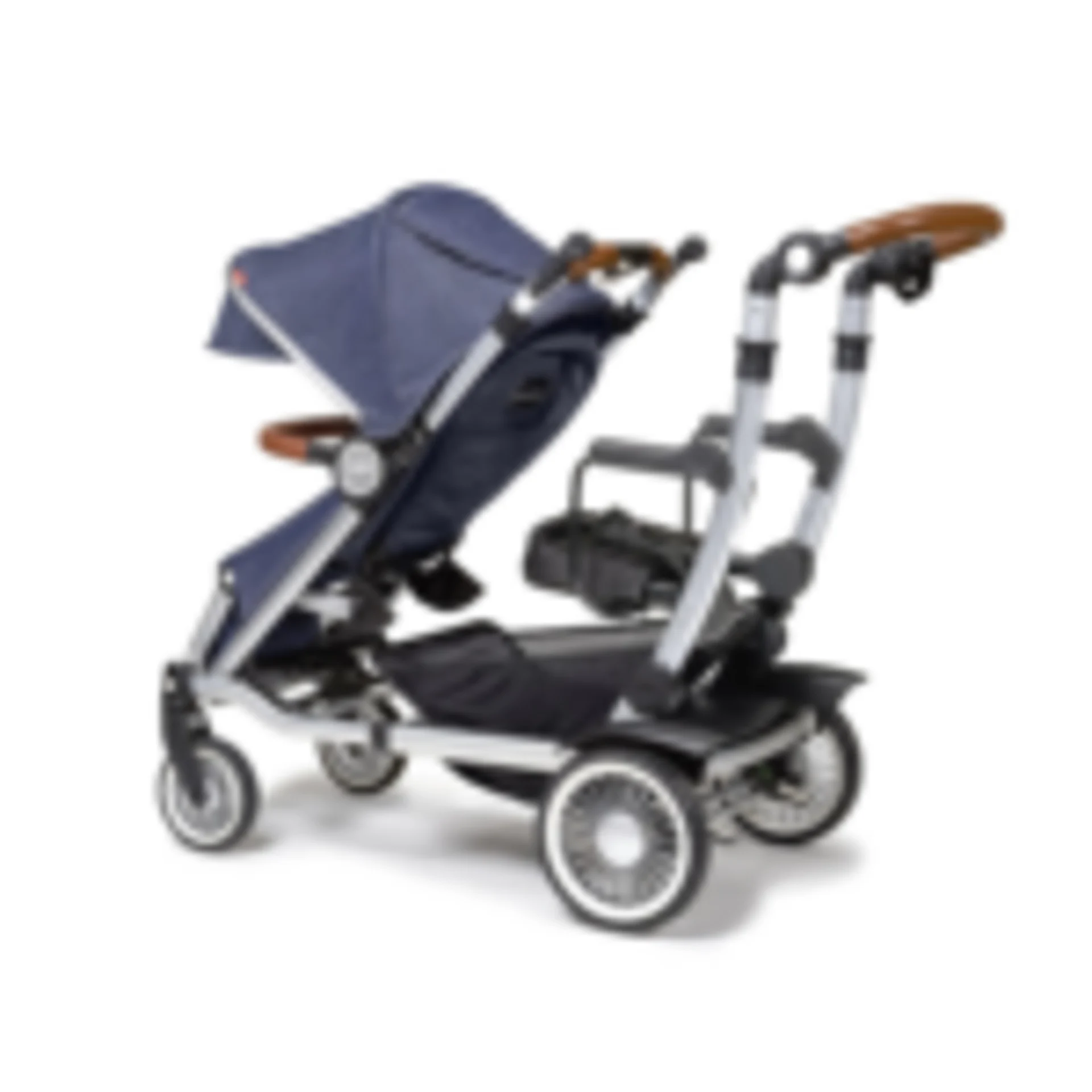 Navy blue tandem double stroller with silver aluminum frame, brown leather handles, sun canopy, and second seat attachment fo