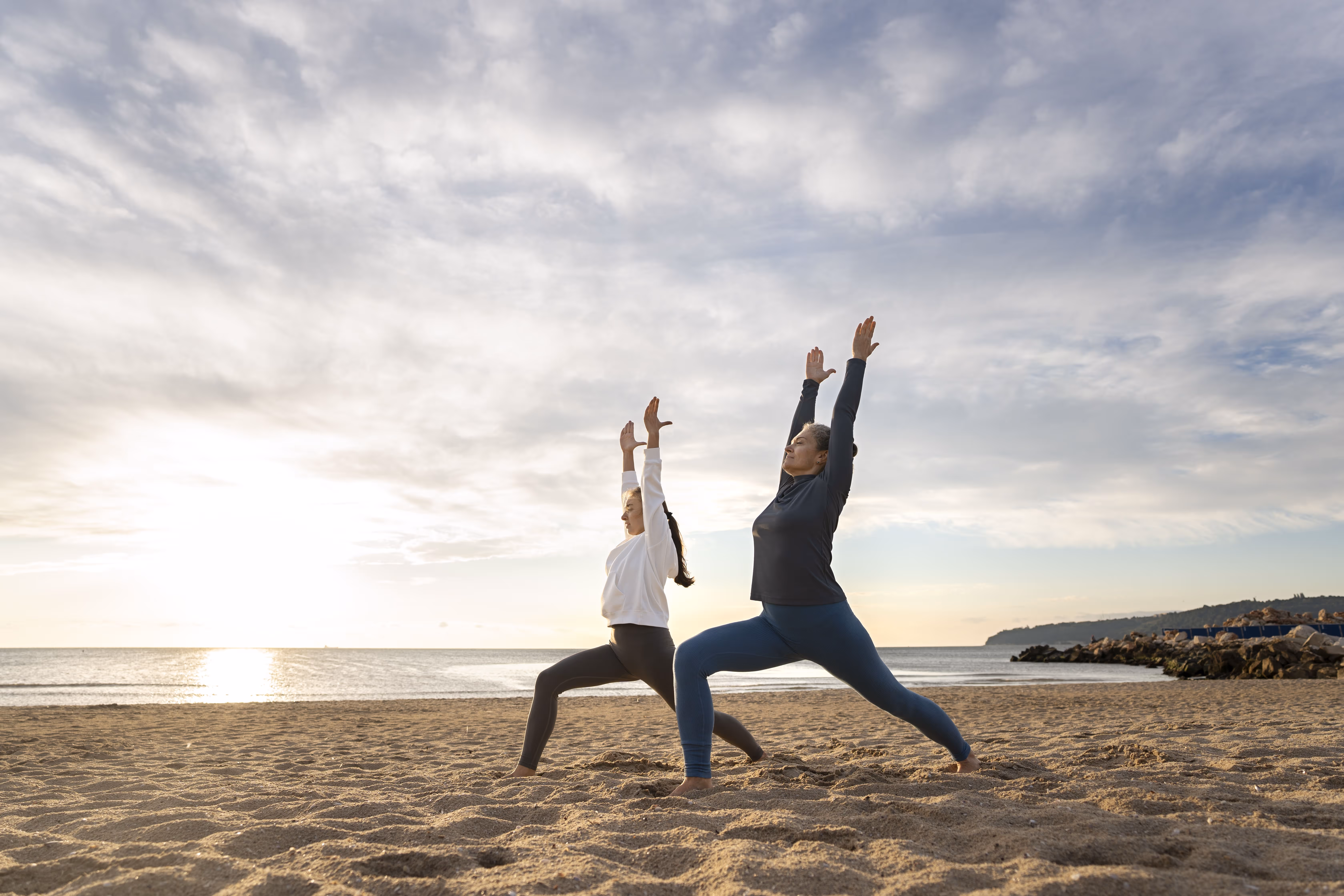 mother-daughter-doing-yoga-side-view