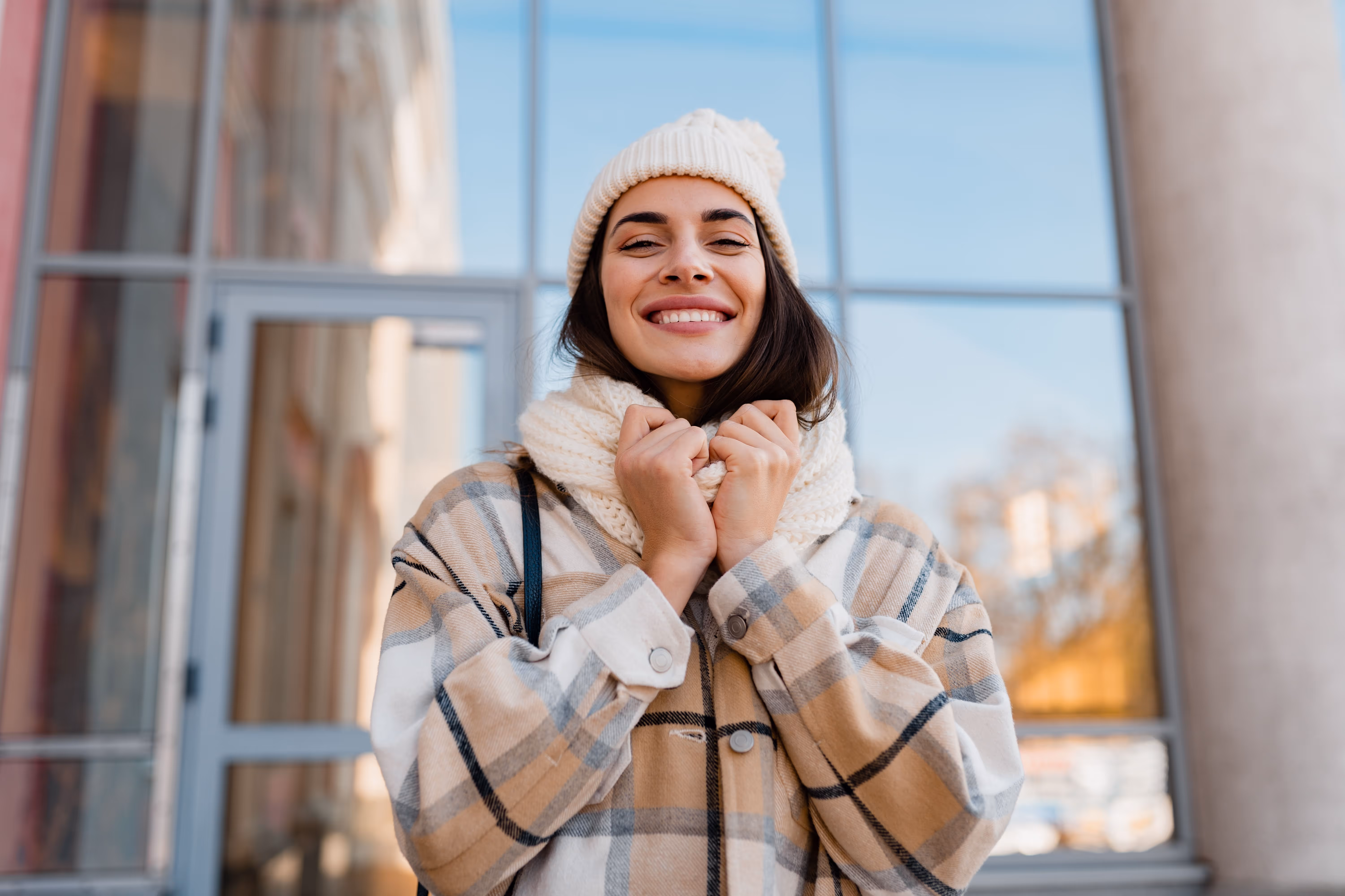 young-smiling-woman-walking-street-winter