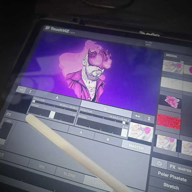 A device screen displaying the TouchVIZ 1.6.4 interface with a vibrant digital illustration of a man with horns and smoke above his head in shades of purple and pink, surrounded by media controls and effect options.