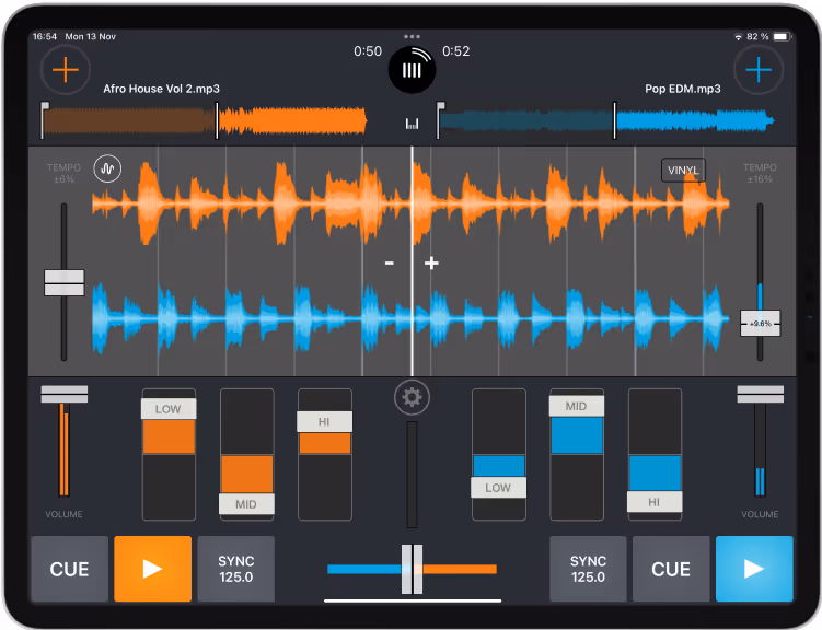 Screenshot of the Cross DJ app running on an iPad, displaying two tracks, 'Afro House Vol 2.mp3' and 'Pop EDM.mp3,' with their waveform views in orange and blue. The waveform view shows the audio tracks' amplitude over time, aiding in identifying beats, breaks, and transitions for mixing. The interface includes volume sliders, cue buttons, sync controls, tempo adjustments, and equalizer settings for low, mid, and high frequencies.