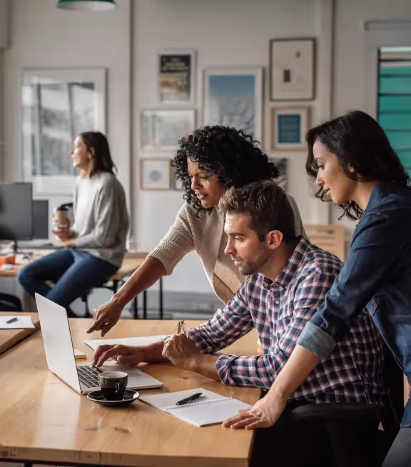 team working together on laptop