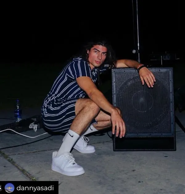 Danny Asadi with a subwoofer