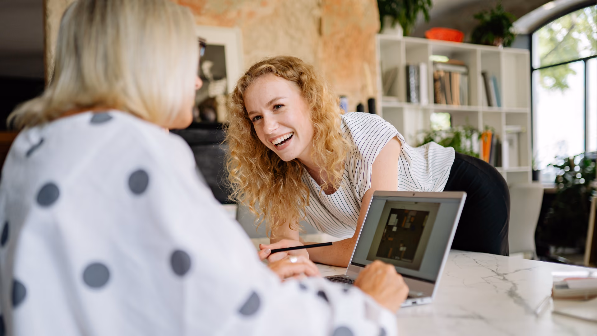 Women working with team