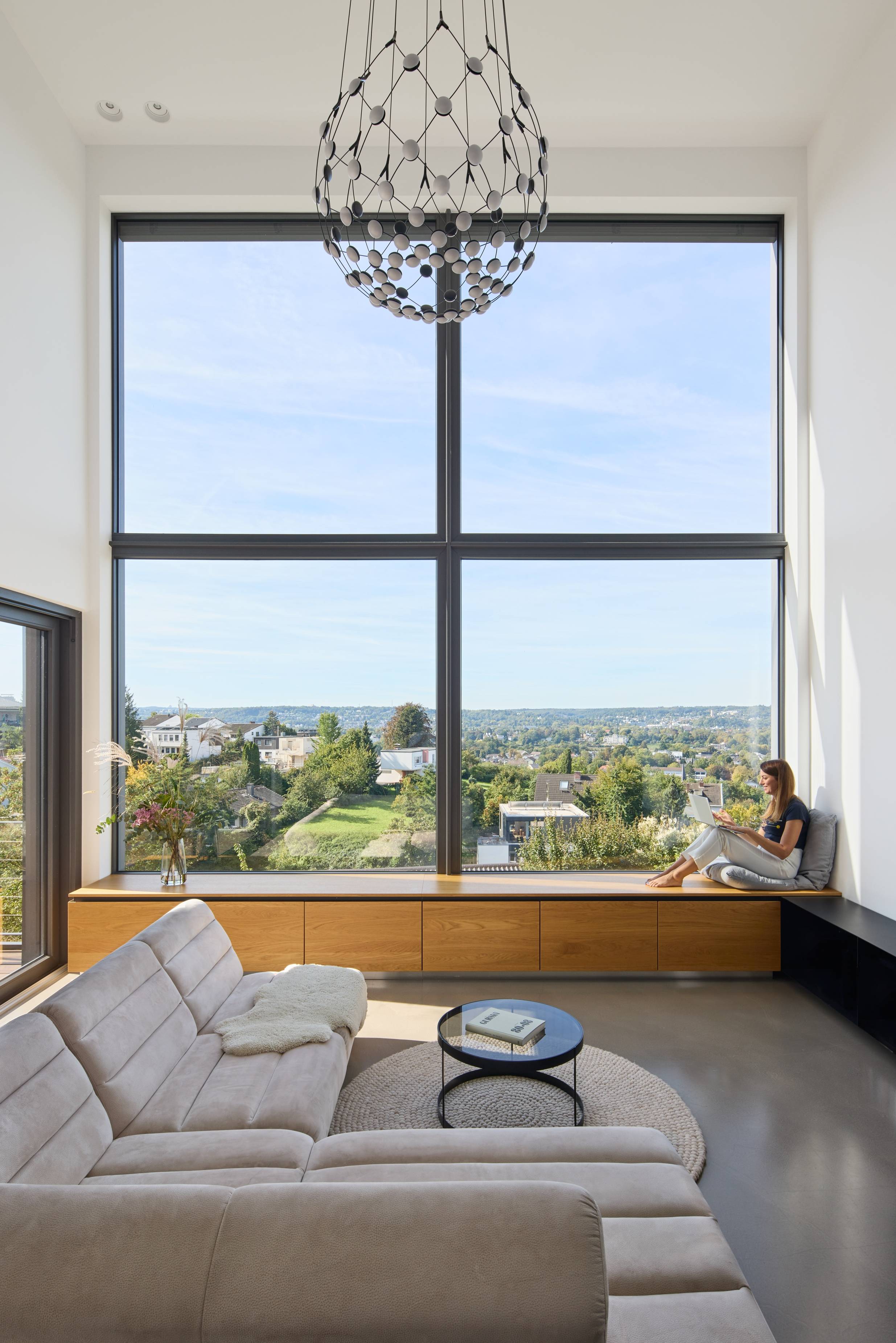 view of a living room with a couch and a large window