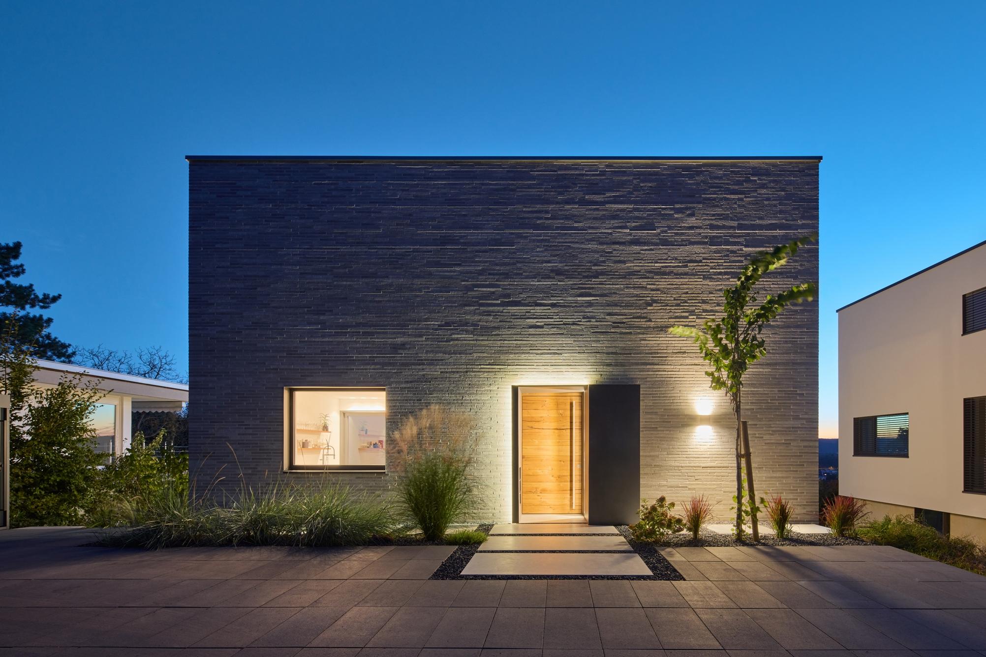 view at the entrance of a modern house by night